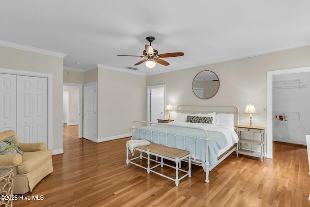 505 Rivage Promenade, Wilmington, NC 28412 - bedroom with a closet, wood finished floors, crown molding, and ceiling fan