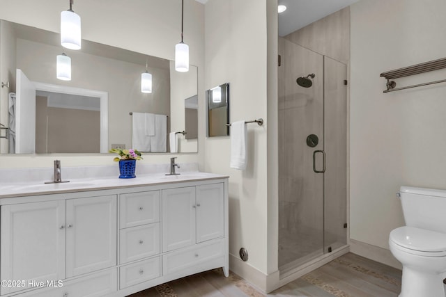 505 Rivage Promenade, Wilmington, NC 28412 - bathroom with wood finished floors, a shower stall, and double vanity
