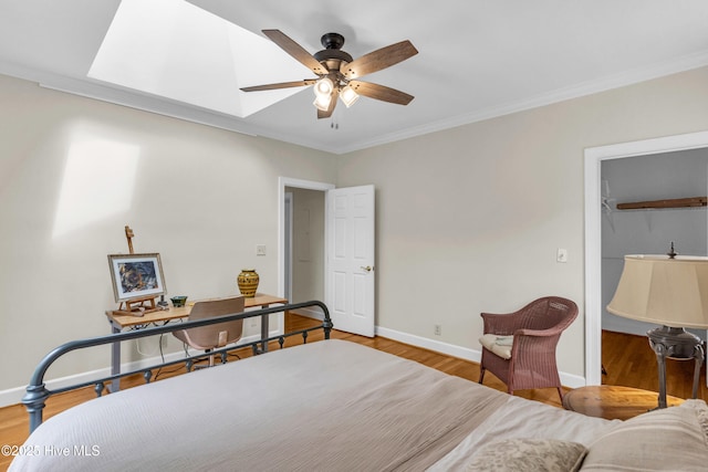 505 Rivage Promenade, Wilmington, NC 28412 - bedroom featuring crown molding, wood finished floors, a ceiling fan, a spacious closet, and a closet