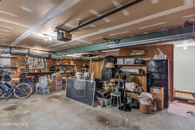 505 Rivage Promenade, Wilmington, NC 28412 - garage featuring a garage door opener and a workshop area