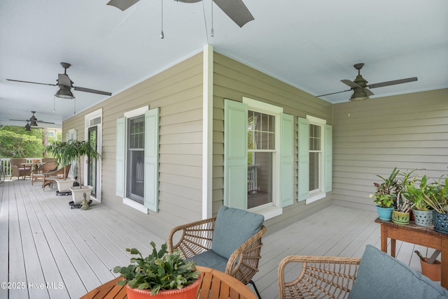 505 Rivage Promenade, Wilmington, NC 28412 - wooden porch featuring ceiling fan and outdoor dining area