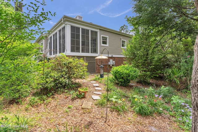 505 Rivage Promenade, Wilmington, NC 28412 - back of property with a chimney and a sunroom