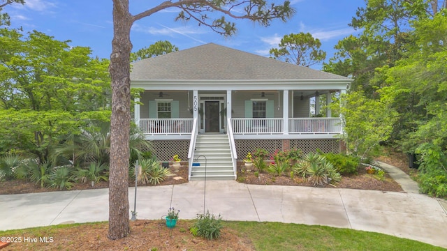 505 Rivage Promenade, Wilmington, NC 28412 - coastal home featuring a ceiling fan, stairway, a porch, and roof with shingles