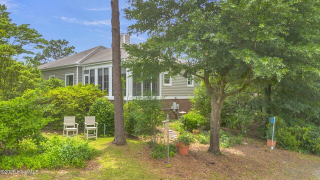 505 Rivage Promenade, Wilmington, NC 28412 - view of side of home with a chimney