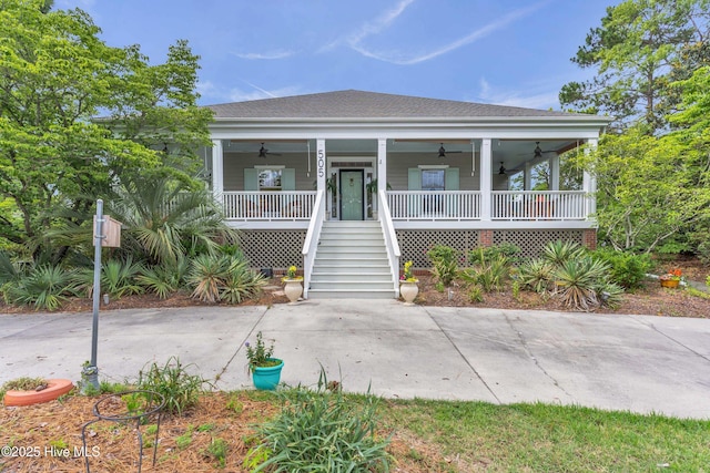505 Rivage Promenade, Wilmington, NC 28412 - view of front facade with a ceiling fan, a porch, stairs, and roof with shingles