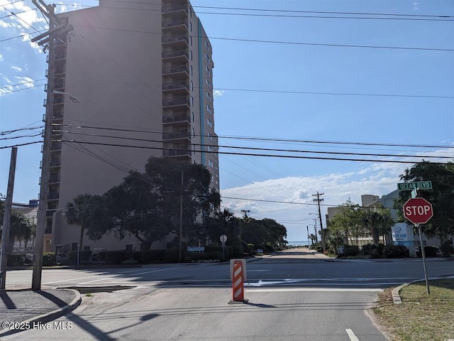 7500 N Ocean Blvd Unit 6061, Myrtle Beach, SC 29572 - view of asphalt road featuring traffic signs