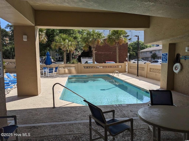 7500 N Ocean Blvd Unit 6061, Myrtle Beach, SC 29572 - community pool with a patio area and a fenced backyard