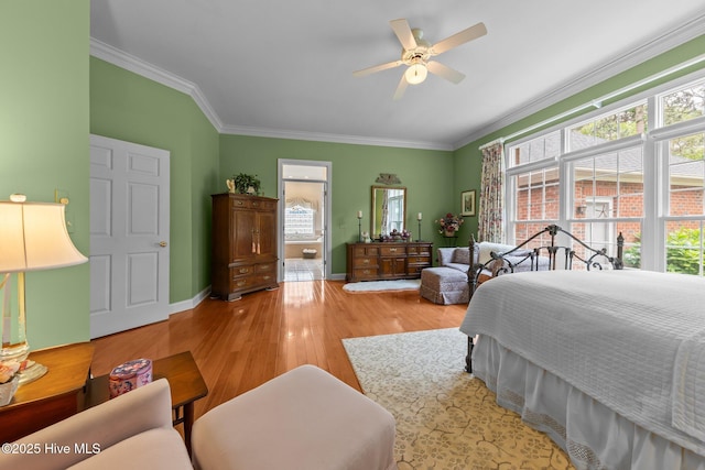 155 Mckenzie Rd E, Pinehurst, NC 28374 - bedroom featuring multiple windows, ornamental molding, wood finished floors, baseboards, and ensuite bath