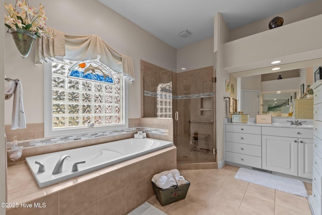 155 Mckenzie Rd E, Pinehurst, NC 28374 - bathroom featuring a stall shower, a bath, vanity, and tile patterned flooring