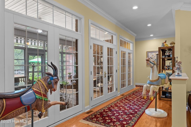 155 Mckenzie Rd E, Pinehurst, NC 28374 - doorway to outside with french doors, ornamental molding, wood finished floors, and recessed lighting
