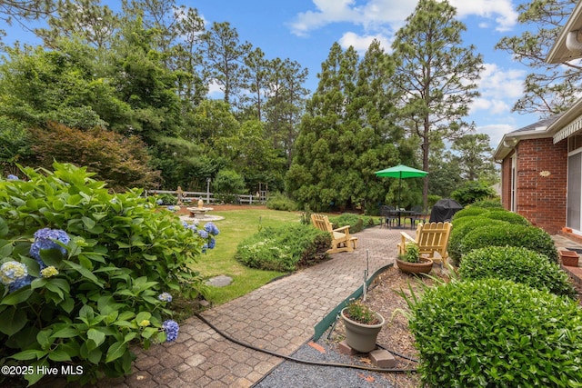 155 Mckenzie Rd E, Pinehurst, NC 28374 - view of green lawn with a patio area