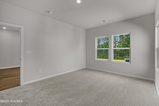 258 Arnette Dr Unit 81B, Ocean Isle Beach, NC 28469 - unfurnished room with carpet flooring, recessed lighting, and a smoke detector