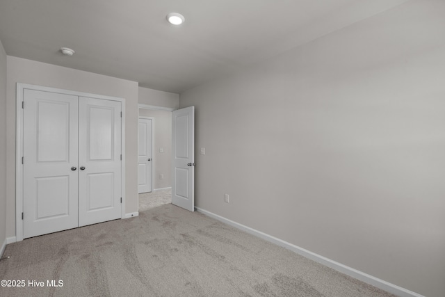 258 Arnette Dr Unit 81B, Ocean Isle Beach, NC 28469 - unfurnished bedroom with a closet and carpet floors