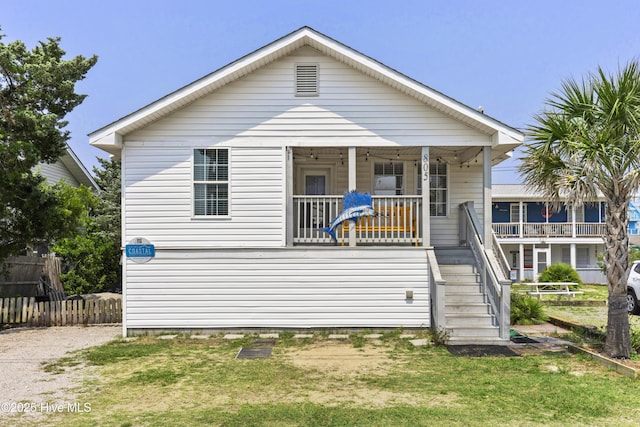 805 Carolina Beach Ave N, Carolina Beach, NC 28428 - view of front of house with stairway and covered porch