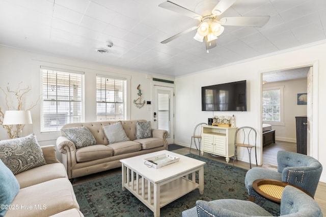 805 Carolina Beach Ave N, Carolina Beach, NC 28428 - living room with crown molding, ceiling fan, dark wood-style flooring, and baseboards