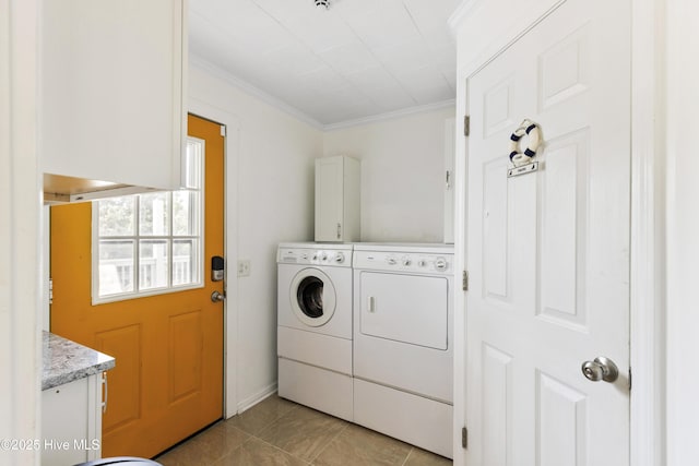 805 Carolina Beach Ave N, Carolina Beach, NC 28428 - laundry room with washer and dryer, crown molding, light tile patterned floors, and cabinet space