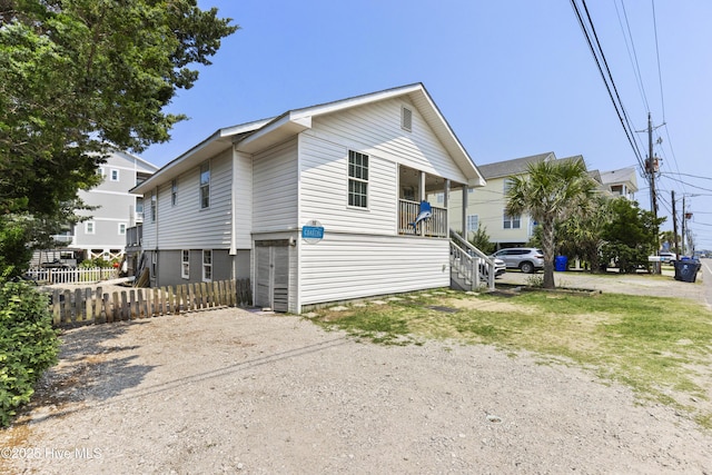 805 Carolina Beach Ave N, Carolina Beach, NC 28428 - view of home's exterior featuring stairs and driveway