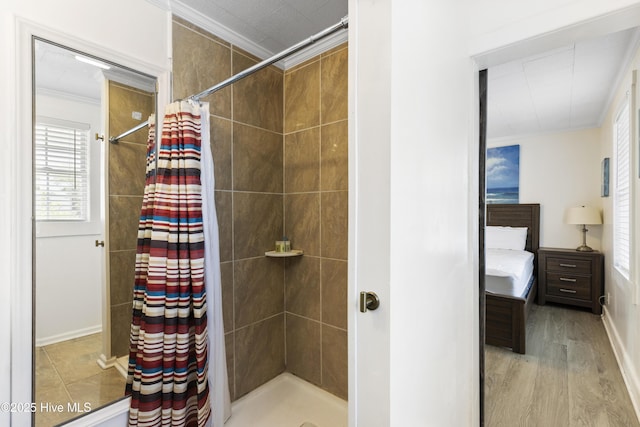 805 Carolina Beach Ave N, Carolina Beach, NC 28428 - bathroom with crown molding, a stall shower, wood finished floors, and baseboards