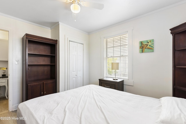 805 Carolina Beach Ave N, Carolina Beach, NC 28428 - bedroom featuring ornamental molding, a closet, and a ceiling fan