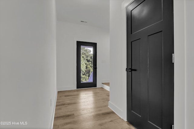 232 Shell Dr, Sneads Ferry, NC 28460 - foyer entrance featuring light wood-style flooring and baseboards
