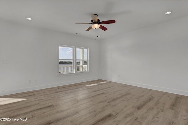 232 Shell Dr, Sneads Ferry, NC 28460 - unfurnished room featuring light wood-type flooring, baseboards, recessed lighting, and a ceiling fan