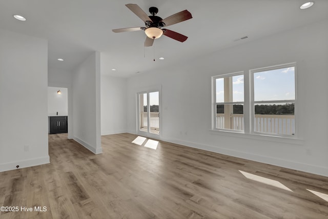 232 Shell Dr, Sneads Ferry, NC 28460 - unfurnished living room with recessed lighting, light wood-type flooring, baseboards, and ceiling fan