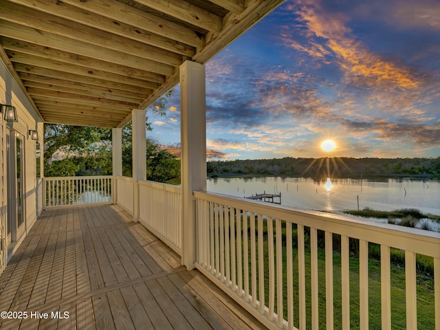 232 Shell Dr, Sneads Ferry, NC 28460 - deck at dusk featuring a water view