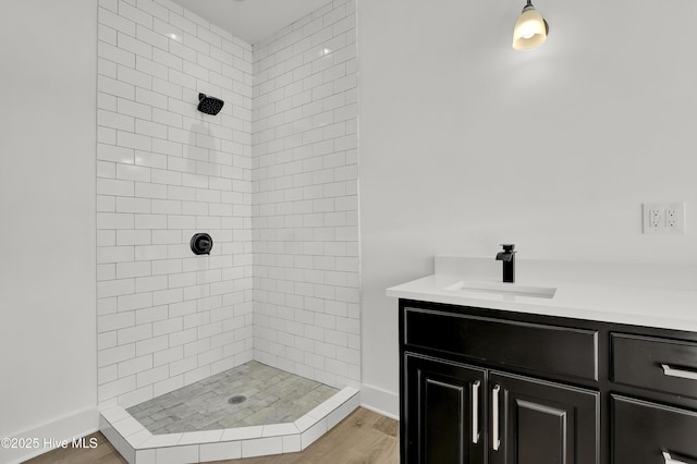 232 Shell Dr, Sneads Ferry, NC 28460 - bathroom with a tile shower, wood finished floors, and vanity