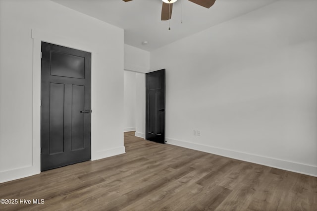 232 Shell Dr, Sneads Ferry, NC 28460 - unfurnished bedroom featuring wood finished floors, baseboards, and a ceiling fan