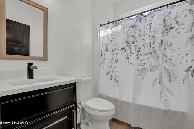 232 Shell Dr, Sneads Ferry, NC 28460 - full bath featuring vanity, toilet, shower / bath combo, and wood finished floors