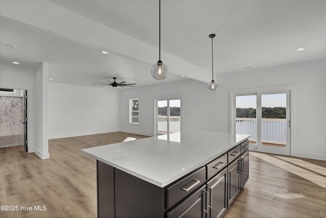232 Shell Dr, Sneads Ferry, NC 28460 - kitchen featuring light countertops, hanging light fixtures, light wood finished floors, and recessed lighting