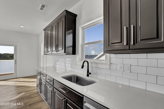 232 Shell Dr, Sneads Ferry, NC 28460 - kitchen with a sink, healthy amount of natural light, decorative backsplash, light countertops, and recessed lighting