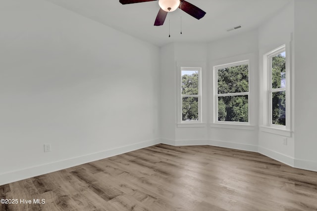 232 Shell Dr, Sneads Ferry, NC 28460 - spare room with plenty of natural light, wood finished floors, and baseboards
