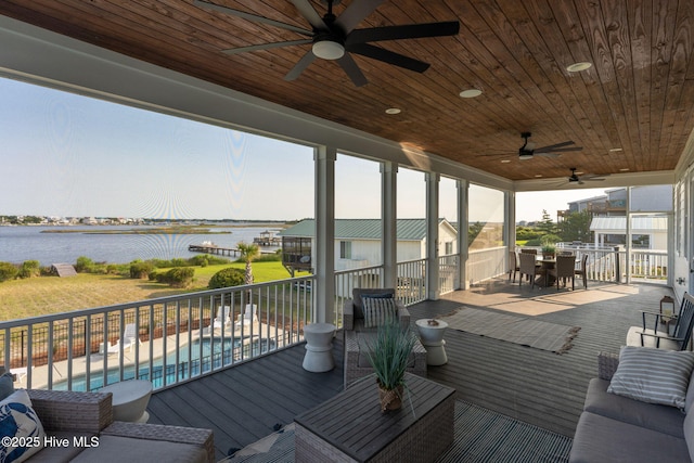 1753 New River Inlet Rd, North Topsail Beach, NC 28460 - wooden deck with outdoor dining area, a water view, and a ceiling fan