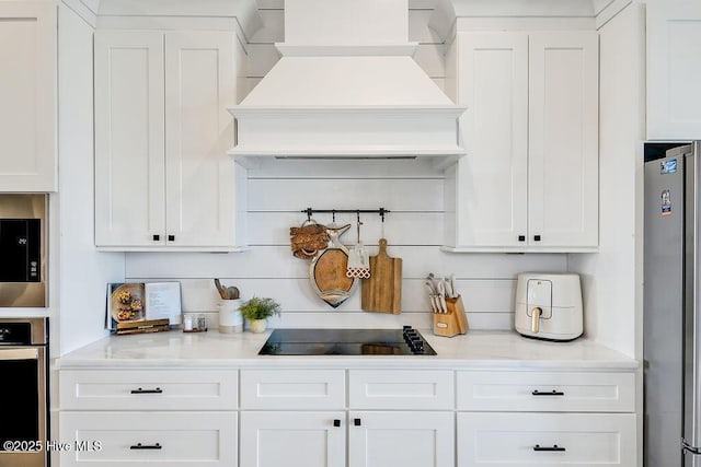 1753 New River Inlet Rd, North Topsail Beach, NC 28460 - kitchen featuring custom range hood, appliances with stainless steel finishes, white cabinetry, and light countertops