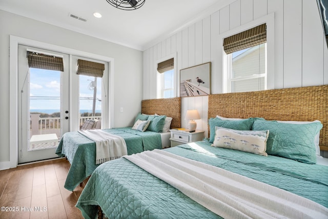 1753 New River Inlet Rd, North Topsail Beach, NC 28460 - bedroom featuring access to outside, french doors, and wood finished floors