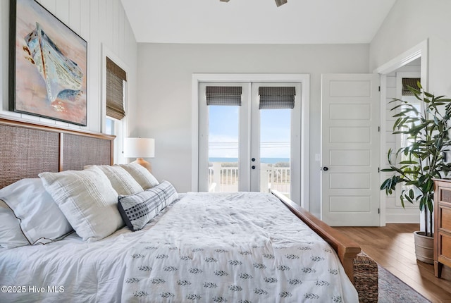 1753 New River Inlet Rd, North Topsail Beach, NC 28460 - bedroom with french doors, access to outside, multiple windows, and wood finished floors