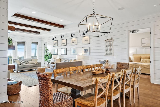 1753 New River Inlet Rd, North Topsail Beach, NC 28460 - dining area with light wood finished floors, beam ceiling, and a chandelier