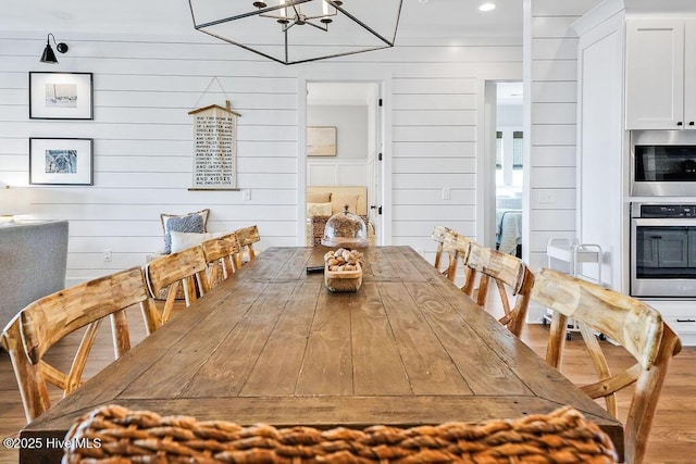 1753 New River Inlet Rd, North Topsail Beach, NC 28460 - dining room with a chandelier and wood finished floors