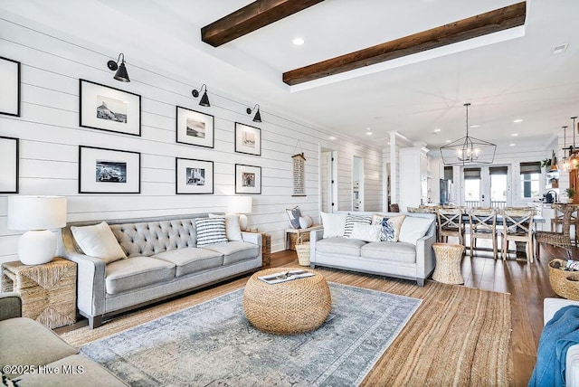 1753 New River Inlet Rd, North Topsail Beach, NC 28460 - living area with wood finished floors, beamed ceiling, a chandelier, and recessed lighting