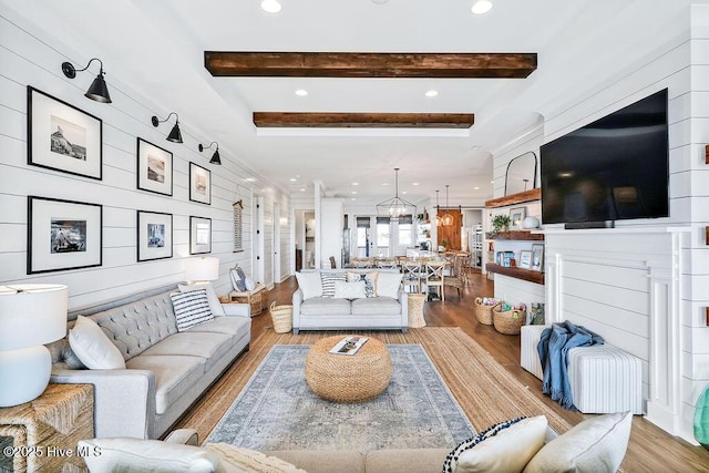 1753 New River Inlet Rd, North Topsail Beach, NC 28460 - living area with beam ceiling, wood finished floors, and recessed lighting