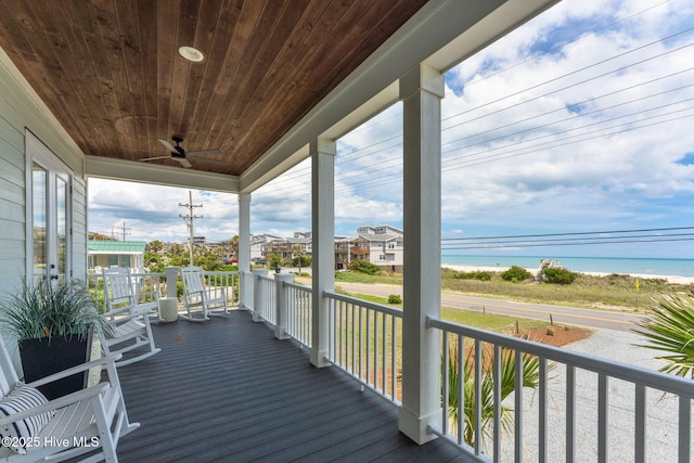 1753 New River Inlet Rd, North Topsail Beach, NC 28460 - wooden porch with ceiling fan and a water view
