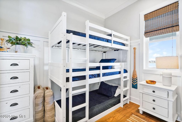 1753 New River Inlet Rd, North Topsail Beach, NC 28460 - bedroom featuring light wood-style floors and ornamental molding