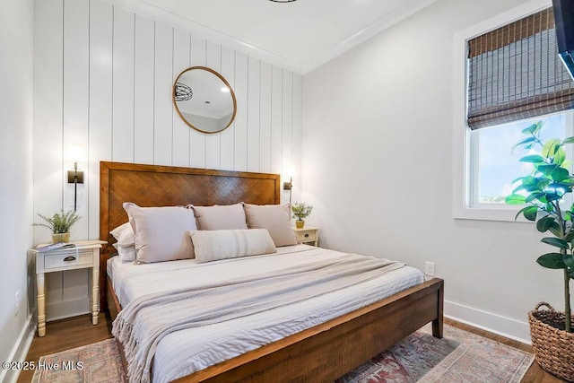 1753 New River Inlet Rd, North Topsail Beach, NC 28460 - bedroom featuring wood finished floors, baseboards, and crown molding