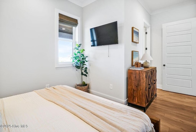 1753 New River Inlet Rd, North Topsail Beach, NC 28460 - bedroom with wood finished floors and baseboards