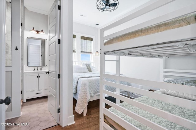 1753 New River Inlet Rd, North Topsail Beach, NC 28460 - bedroom featuring ensuite bath and a sink