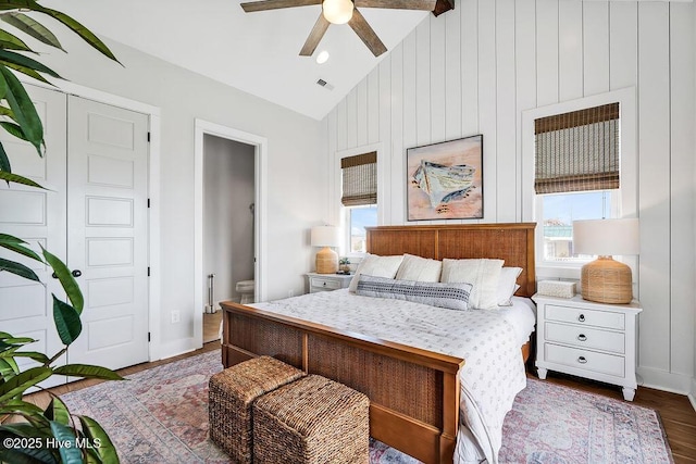 1753 New River Inlet Rd, North Topsail Beach, NC 28460 - bedroom featuring vaulted ceiling, dark wood finished floors, connected bathroom, ceiling fan, and baseboards