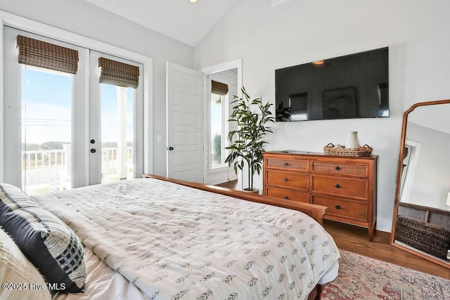 1753 New River Inlet Rd, North Topsail Beach, NC 28460 - bedroom featuring access to exterior, french doors, vaulted ceiling, wood finished floors, and baseboards