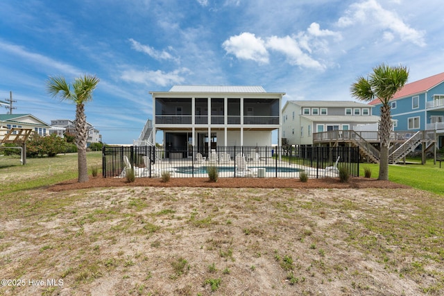 1753 New River Inlet Rd, North Topsail Beach, NC 28460 - back of property with stairs, a sunroom, a patio, and metal roof