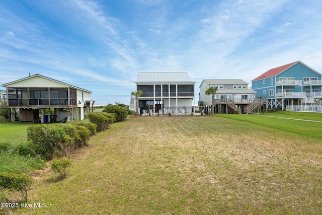 1753 New River Inlet Rd, North Topsail Beach, NC 28460 - back of property with a yard and metal roof